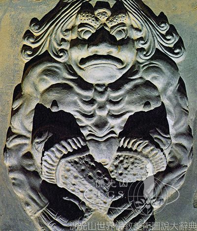 修定寺塔挑檐下力士像